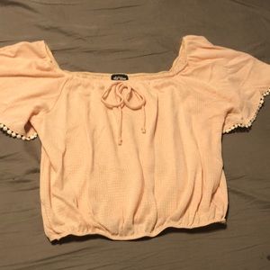 Peach colored off shoulder style blouse